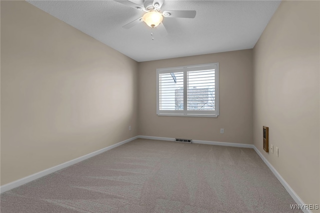 20 Harbour Pointe, Buffalo, NY 14202 - empty room featuring light carpet, a ceiling fan, baseboards, a textured ceiling, and heating unit