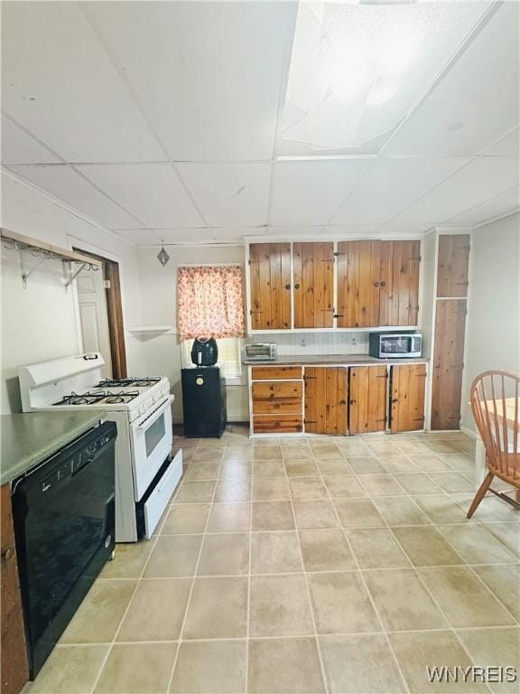 66 Northrup Pl, Buffalo, NY 14214 - kitchen with white gas range oven, dishwasher, stainless steel microwave, a paneled ceiling, and brown cabinetry