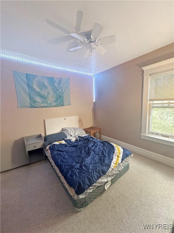 66 Northrup Pl, Buffalo, NY 14214 - carpeted bedroom featuring baseboards and a ceiling fan