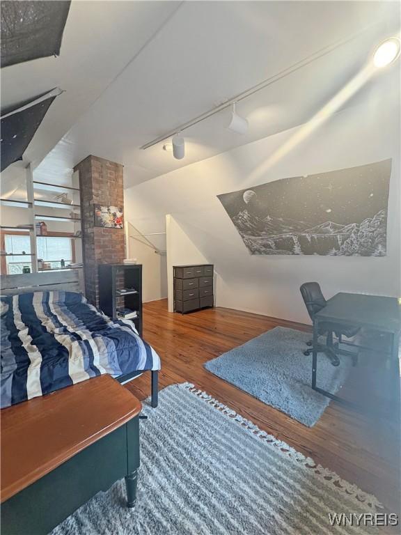66 Northrup Pl, Buffalo, NY 14214 - bedroom featuring rail lighting and wood finished floors