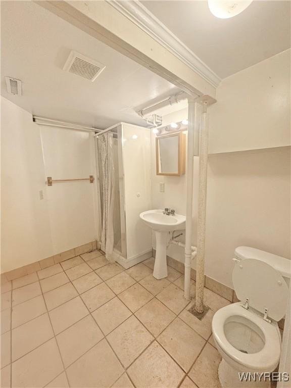 66 Northrup Pl, Buffalo, NY 14214 - full bathroom with tile patterned flooring, a shower stall, baseboards, and toilet