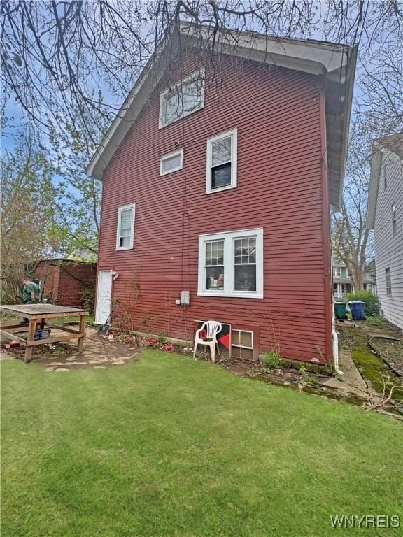 66 Northrup Pl, Buffalo, NY 14214 - rear view of house with a lawn