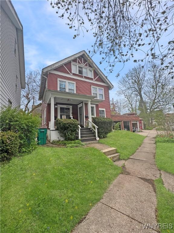 66 Northrup Pl, Buffalo, NY 14214 - view of front of property with a front lawn and a porch
