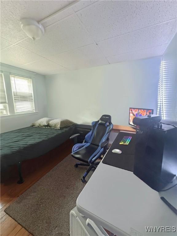75 Northrup Pl, Buffalo, NY 14214 - bedroom featuring wood finished floors and a desk