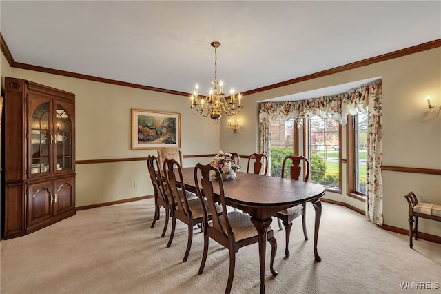 dining area featuring baseboards, light carpet, a chandelier, and crown molding