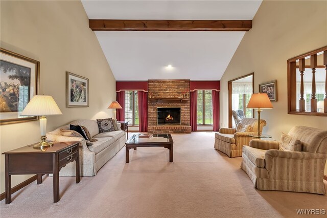 carpeted living area featuring beam ceiling, a fireplace, and high vaulted ceiling