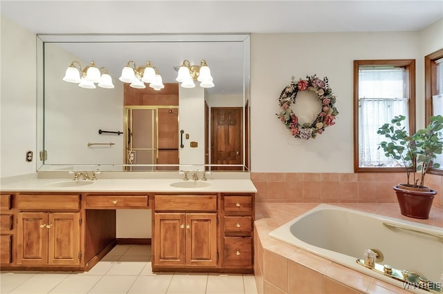 bathroom with a stall shower, a garden tub, double vanity, and tile patterned floors