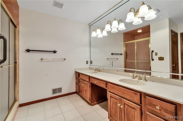 bathroom with a stall shower, double vanity, a chandelier, tile patterned floors, and baseboards