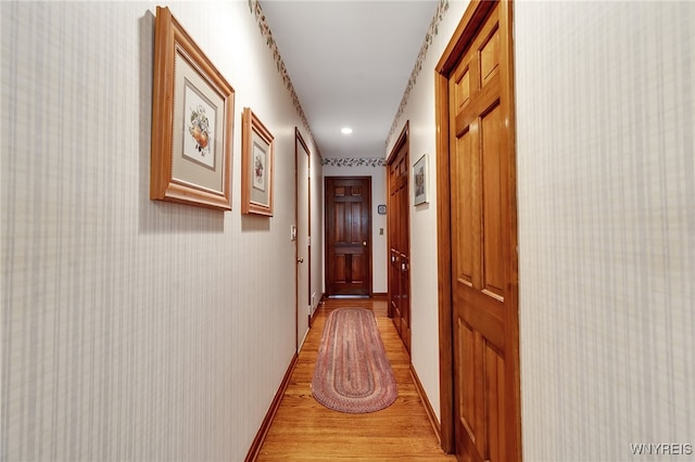 corridor featuring light wood-style floors and recessed lighting