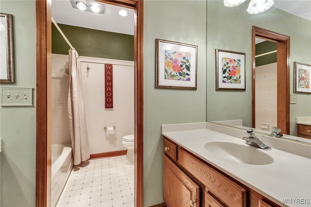 full bathroom featuring toilet, vanity, and shower / bath combo with shower curtain