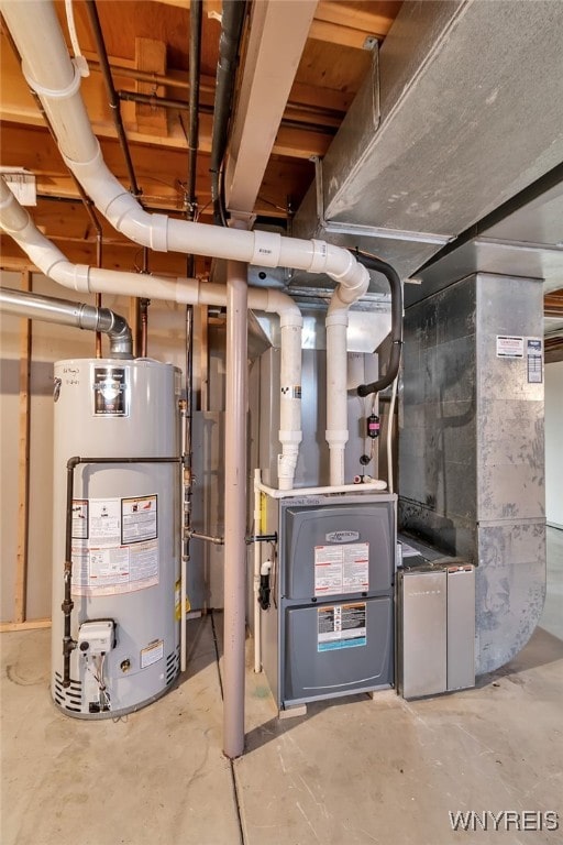 utility room featuring water heater