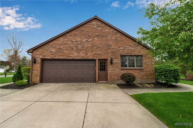 view of front of home featuring brick siding, a garage, and concrete driveway