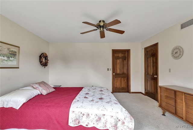 bedroom featuring carpet, a ceiling fan, and baseboards