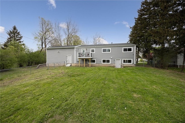 rear view of house featuring a wooden deck