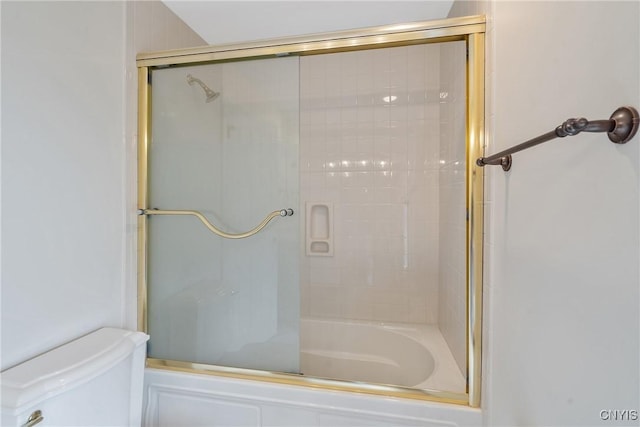 full bathroom with shower / bath combination with glass door and toilet