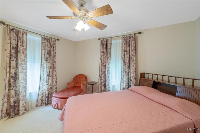 carpeted bedroom with a ceiling fan