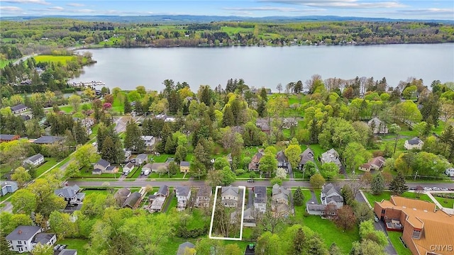 aerial view of residential area featuring a nearby body of water