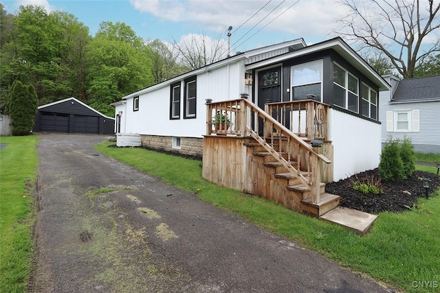 113 Olmstead Pl, Onondaga, NY 13219 - view of front facade with a garage and an outdoor structure