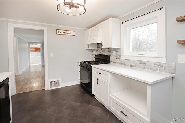 113 Olmstead Pl, Onondaga, NY 13219 - kitchen featuring black appliances, decorative backsplash, healthy amount of natural light, light countertops, and ornamental molding
