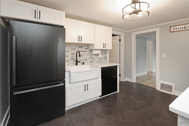 113 Olmstead Pl, Onondaga, NY 13219 - kitchen featuring freestanding refrigerator, dishwasher, tasteful backsplash, a sink, and light countertops