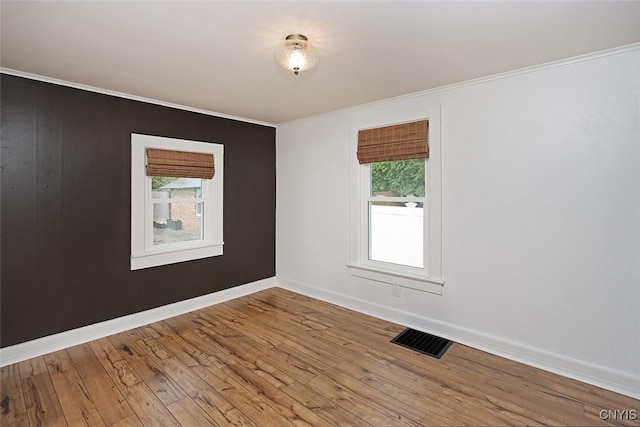 113 Olmstead Pl, Onondaga, NY 13219 - unfurnished room with crown molding, hardwood / wood-style floors, plenty of natural light, and baseboards