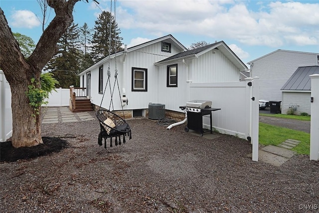 113 Olmstead Pl, Onondaga, NY 13219 - view of front of home with cooling unit, board and batten siding, and fence