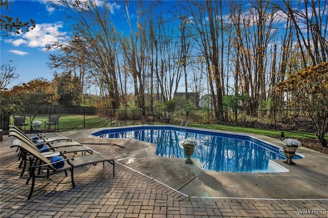 view of pool with a patio and a fenced backyard