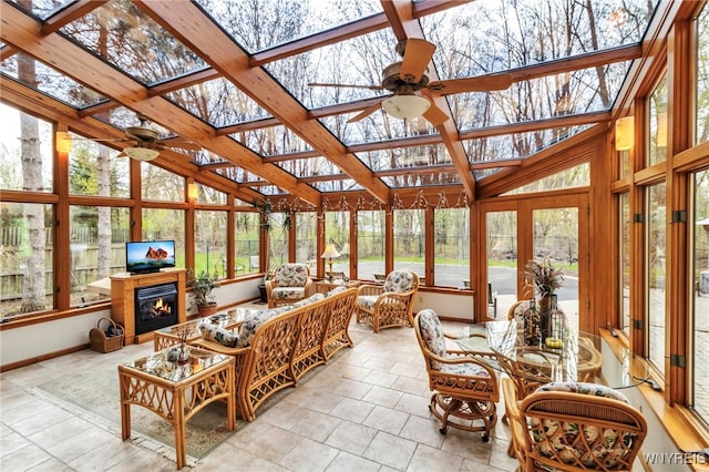 sunroom / solarium featuring vaulted ceiling