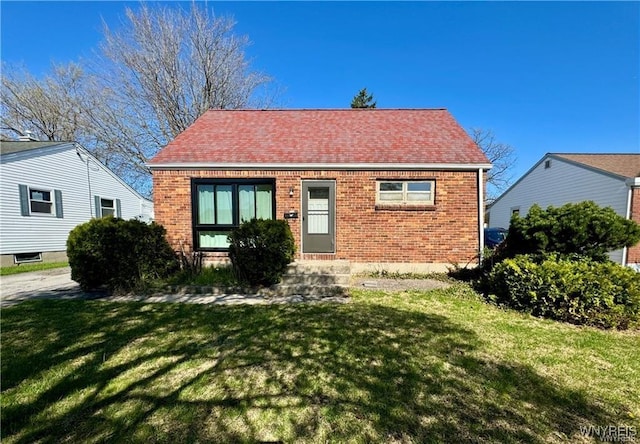 88 Loretto Dr, Cheektowaga, NY 14225 - view of front of home with brick siding and a front lawn