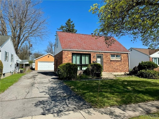 88 Loretto Dr, Cheektowaga, NY 14225 - view of front facade with brick siding, a garage, a front yard, and an outbuilding