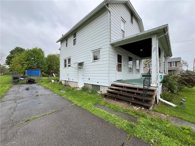 324 W Ave, Elmira-City, NY 14904 - view of property exterior with a porch