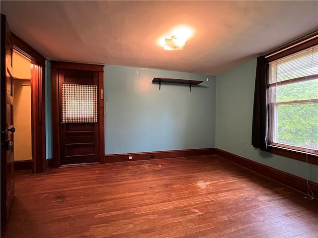 324 W Ave, Elmira-City, NY 14904 - empty room featuring wood finished floors and baseboards