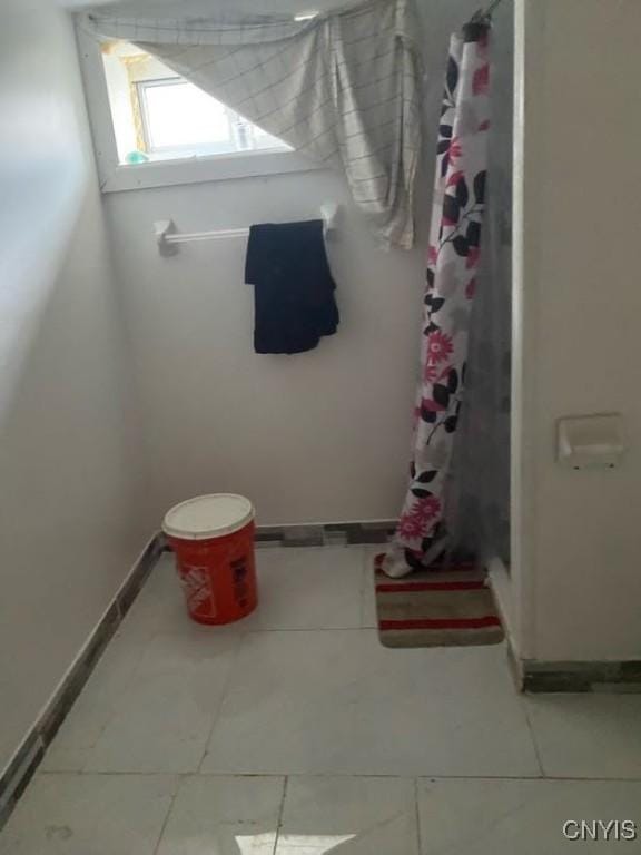 413 Fitch St, Syracuse, NY 13204 - bathroom featuring a shower stall and tile patterned flooring