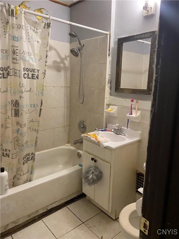413 Fitch St, Syracuse, NY 13204 - bathroom with shower / tub combo, toilet, tile patterned flooring, and vanity