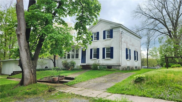 neoclassical / greek revival house with a front yard