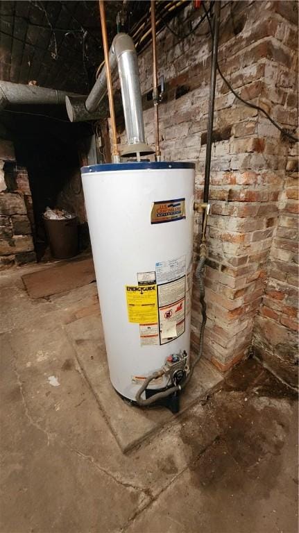 utility room featuring gas water heater