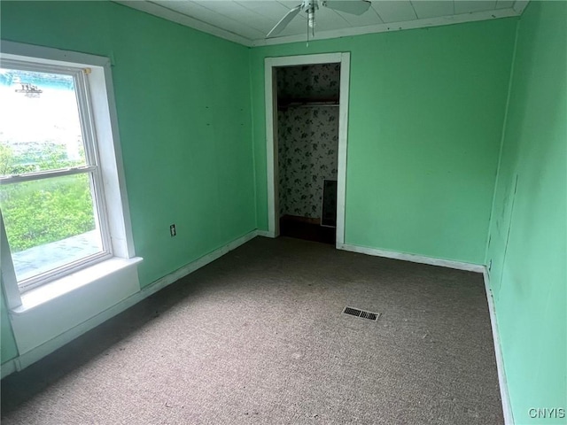 109 Mechanic St, Antwerp, NY 13608 - unfurnished room featuring ceiling fan, dark colored carpet, and baseboards