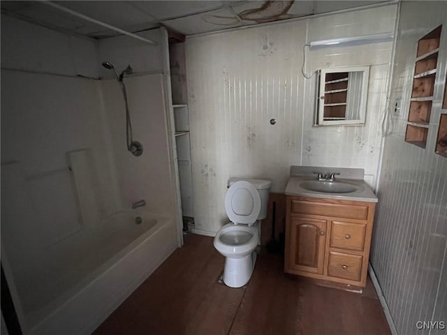 109 Mechanic St, Antwerp, NY 13608 - bathroom featuring wood finished floors, toilet, vanity, and tub / shower combination