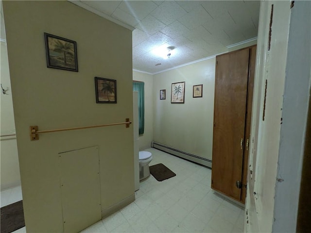 bathroom with a baseboard radiator, tile patterned floors, toilet, and crown molding