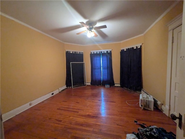 unfurnished bedroom featuring wood finished floors, crown molding, baseboards, ceiling fan, and baseboard heating