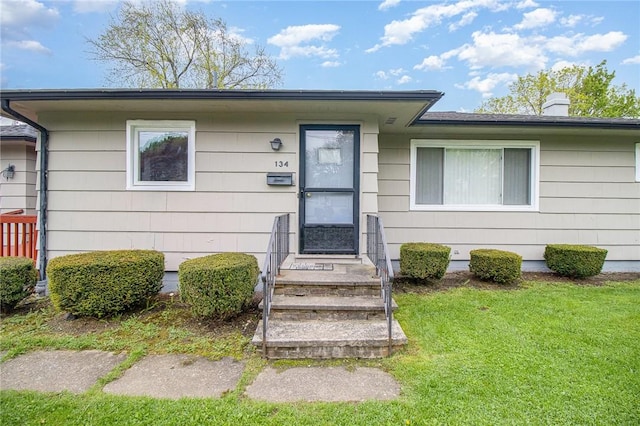 134 Schum Ln, Rochester, NY 14609 - entrance to property with a lawn and a chimney