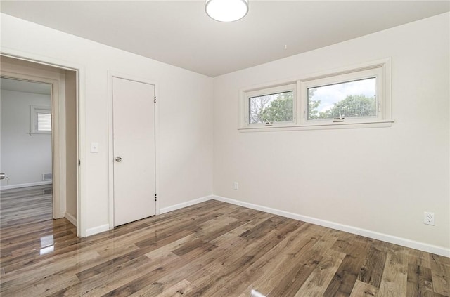 134 Schum Ln, Rochester, NY 14609 - spare room featuring baseboards and wood finished floors