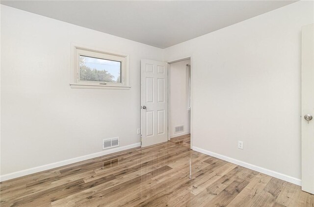 134 Schum Ln, Rochester, NY 14609 - spare room with wood finished floors and baseboards