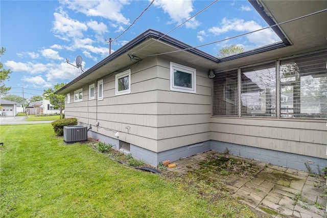 134 Schum Ln, Rochester, NY 14609 - view of property exterior featuring central AC unit and a yard