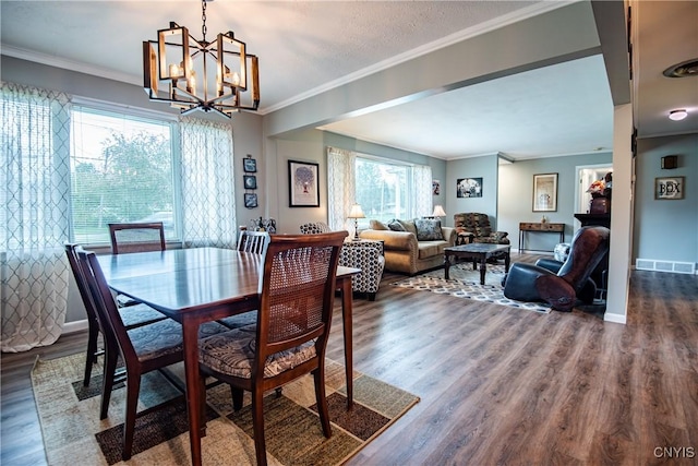 7732 Gifford Rd, Rome-Inside, NY 13440 - dining area featuring a chandelier, dark wood-type flooring, ornamental molding, and baseboards