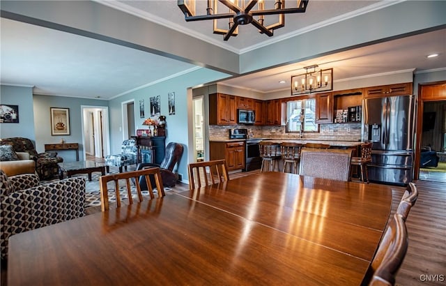 7732 Gifford Rd, Rome-Inside, NY 13440 - dining room featuring a chandelier, wood finished floors, and ornamental molding