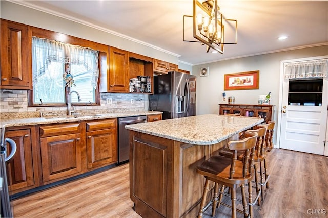 7732 Gifford Rd, Rome-Inside, NY 13440 - kitchen with appliances with stainless steel finishes, a sink, brown cabinetry, decorative backsplash, and ornamental molding