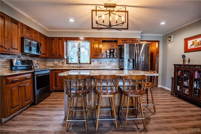 7732 Gifford Rd, Rome-Inside, NY 13440 - kitchen featuring appliances with stainless steel finishes, a center island, a kitchen bar, tasteful backsplash, and dark wood-style floors