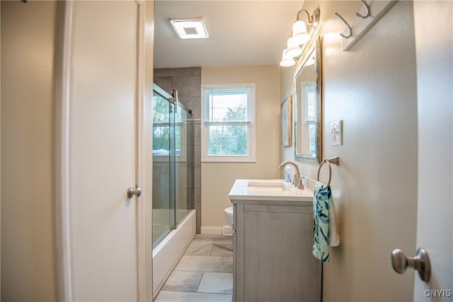 7732 Gifford Rd, Rome-Inside, NY 13440 - bathroom with marble finish flooring, toilet, vanity, bath / shower combo with glass door, and baseboards