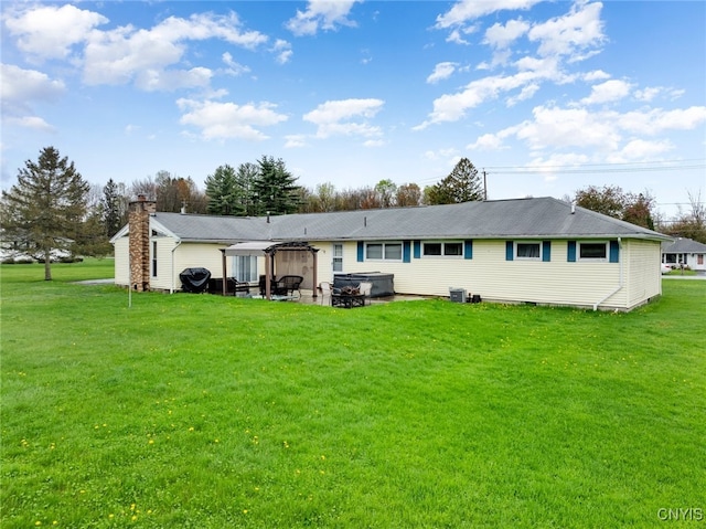 7732 Gifford Rd, Rome-Inside, NY 13440 - rear view of property with a hot tub, a yard, a gazebo, a chimney, and a patio area